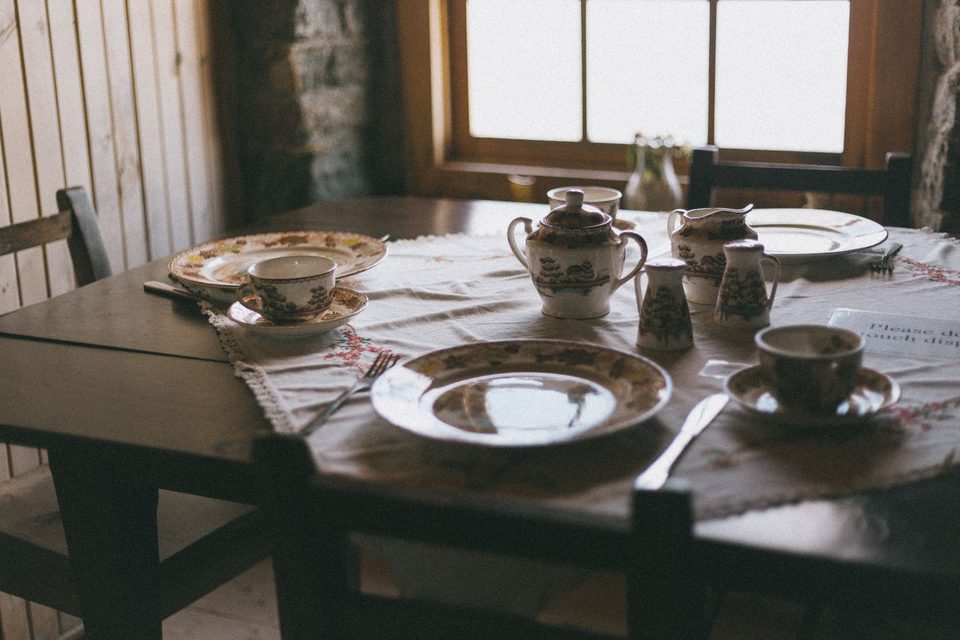 Contrasting crockery on a plain table, which is a dementia design decision rather than a style one